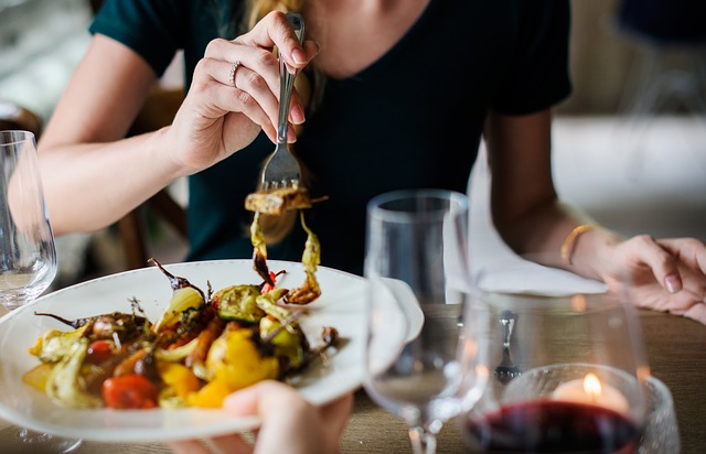 A Woman Enjoying Her Meal at a Restaurant